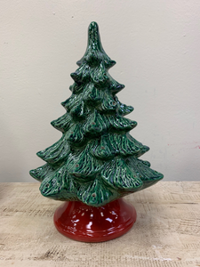 Hand Painted Medium Christmas Tree stands 12" high, but on the base it measures 14" high.  It has a green lustre glaze and red base!  It comes with multi-color pin lights, orange star and a clip-in light kit (7 watt bulb).    Includes free curbside pickup or free shipping.