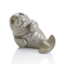 Load image into Gallery viewer, Our ceramic Manatee Party Animal is a great Paint and Learn piece.  Did you know... manatees, sometimes called &quot;Sea Cows&quot;, are slow-moving marine mammals who live in coastal waters and rivers. They can grow up to 13 feet long and 1,300 pounds.

