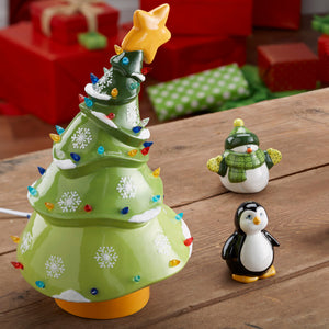 The Animated Christmas Tree will add a little whimsy to the holiday season. Reminiscent of cartoon trees, it's fun, unique and full of holiday cheer!    This tree stands 13 1/4" high. It comes with multi-color pin lights and a clip-in light kit (7 watt bulb).